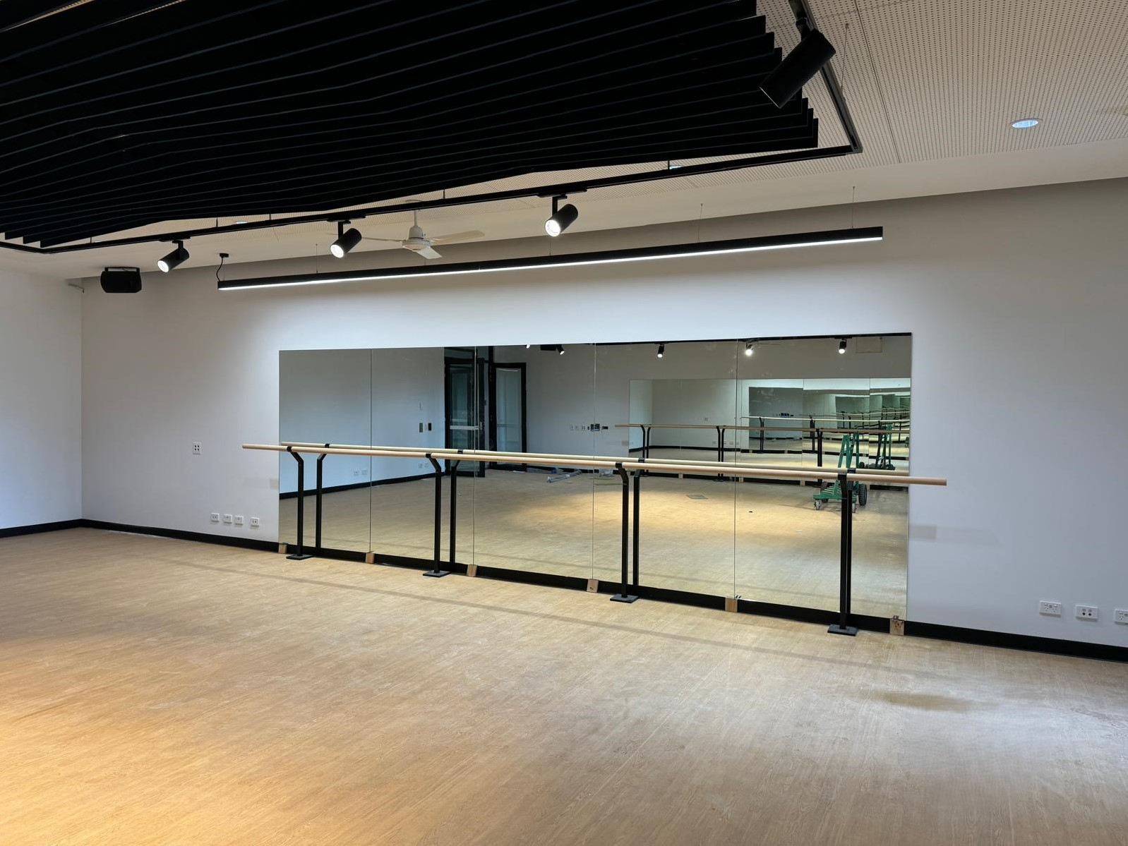 Wall-to-wall studio mirror installation