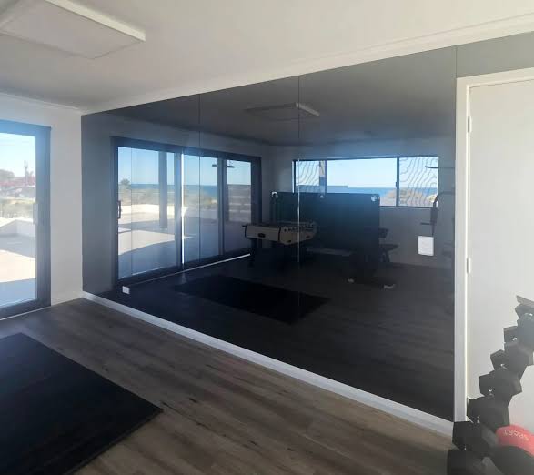 Custom home gym mirror wall